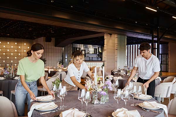 A group setting a table for a party in the Bay Area