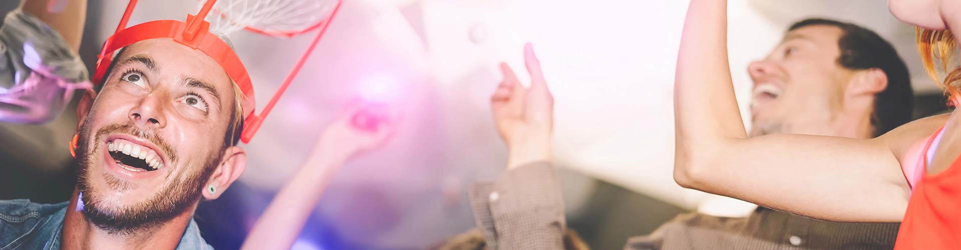 Person reaching out to the sky at outdoor party